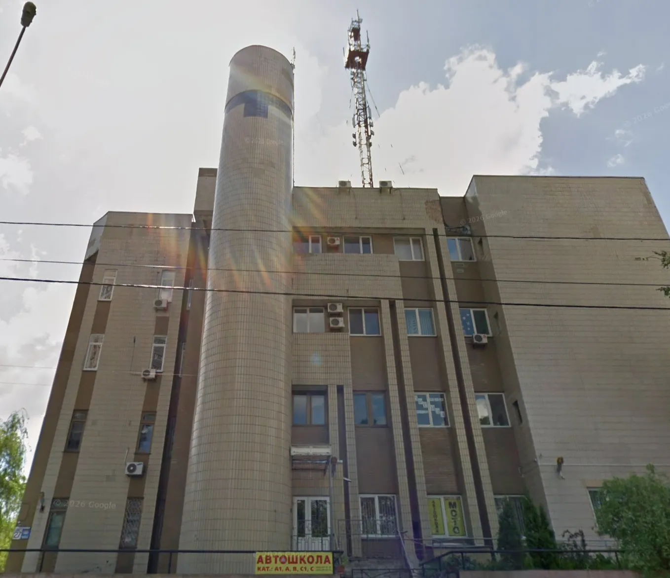 The building where all of this happened: an old Soviet-built cross-connect station, with narrow windows and the hollow walls a pigeon could fall inside.